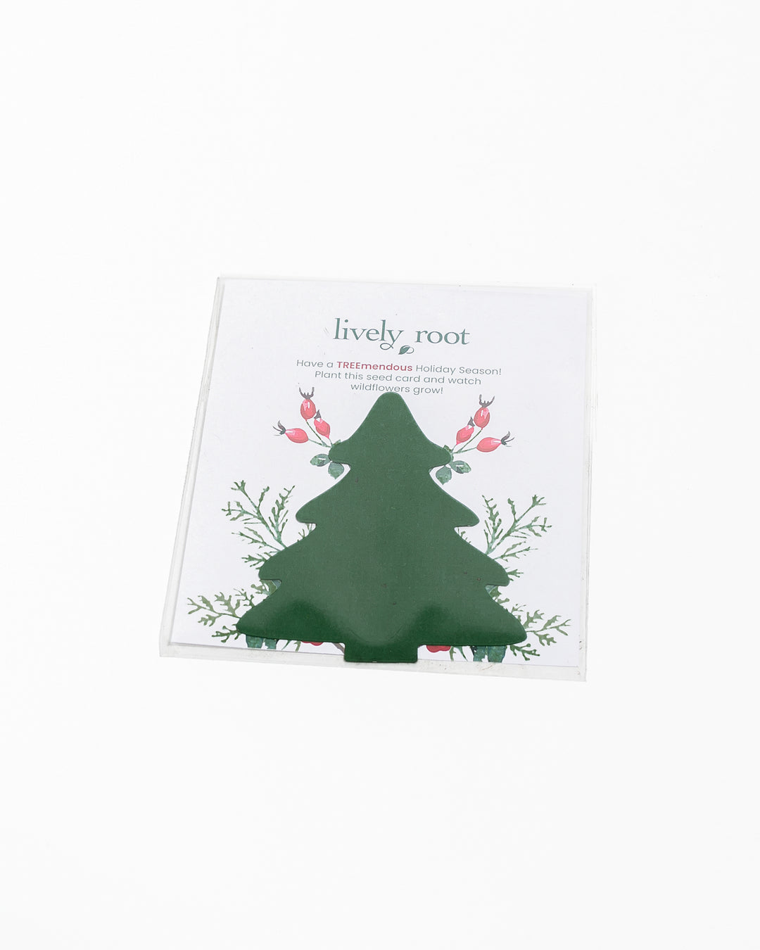 Lively Root holiday seed paper greeting card featuring green tree die-cut shape with botanical wildflower illustrations and "TREEmendous Holiday Season" message, plantable card that grows wildflowers.