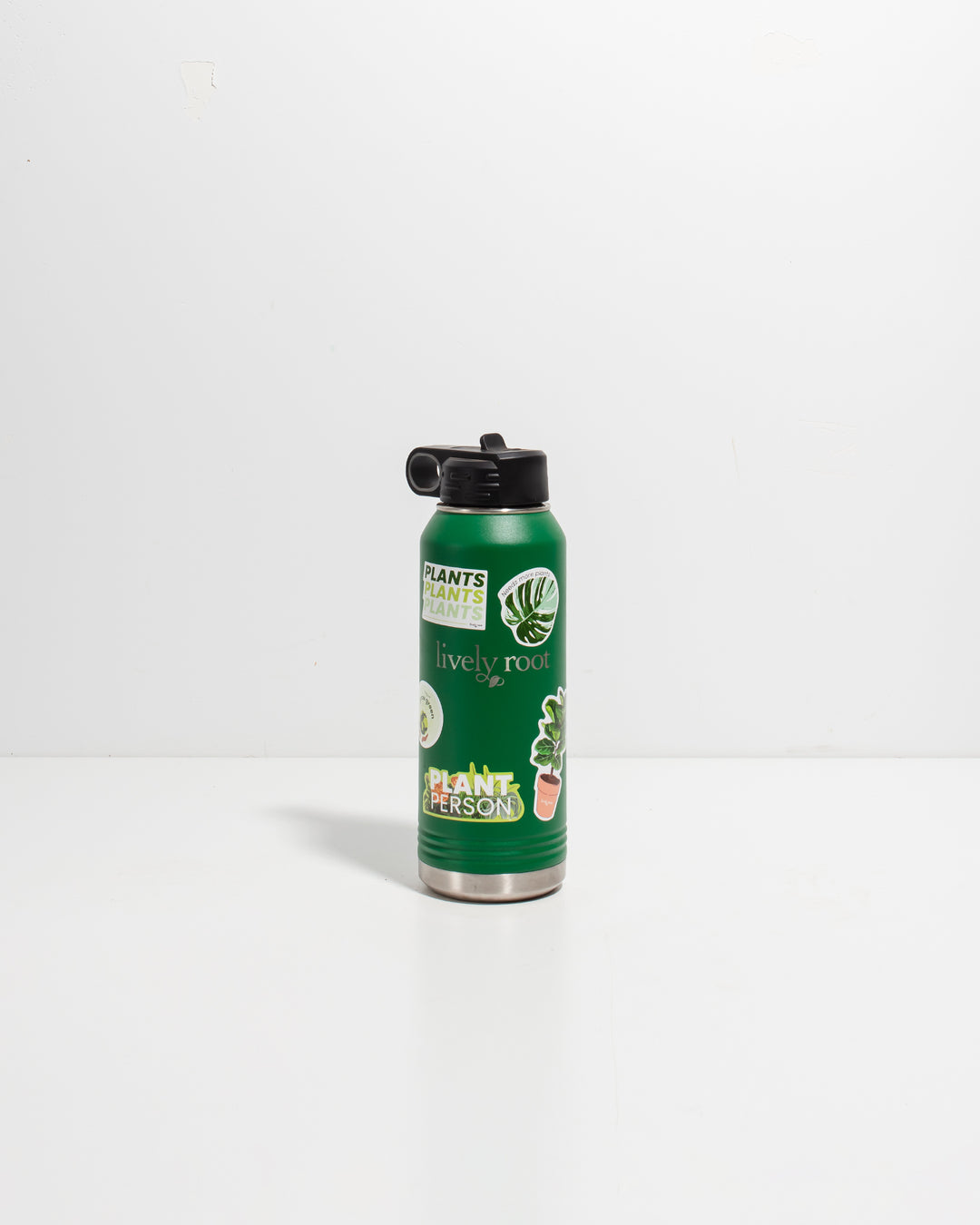 Lively Root green insulated water bottle featuring "Plant Person" text and decorative plant stickers including monstera leaf and potted plant designs, perfect for plant-loving hydration and eco-friendly drinkware.